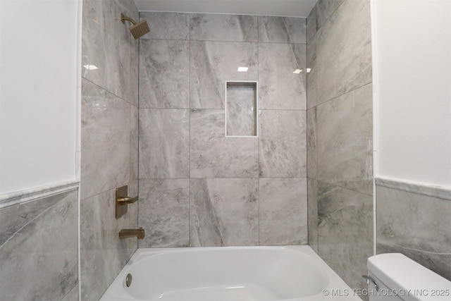 209 E Falletti Ave, Claremore, OK 74017 - full bath with tile walls, bathing tub / shower combination, and a wainscoted wall