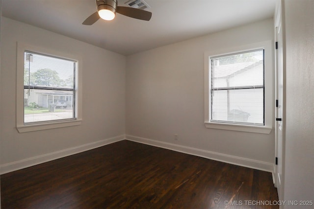 209 E Falletti Ave, Claremore, OK 74017 - spare room featuring dark wood-style floors and ceiling fan