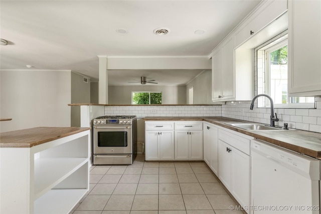 2904 S Hudson Pl, Tulsa, OK 74114 - kitchen featuring white dishwasher, stainless steel gas stove, butcher block counters, tasteful backsplash, and a ceiling fan