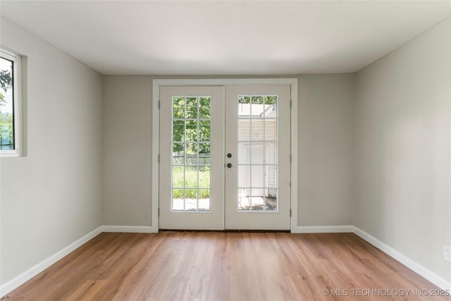 2904 S Hudson Pl, Tulsa, OK 74114 - doorway to outside featuring light wood-type flooring, healthy amount of natural light, and french doors