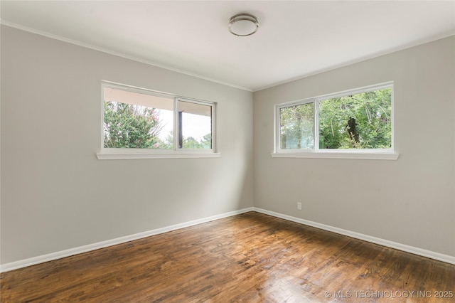 2904 S Hudson Pl, Tulsa, OK 74114 - spare room featuring wood finished floors and ornamental molding