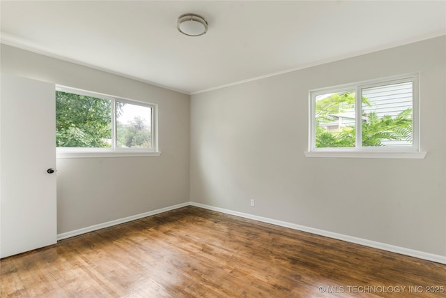 2904 S Hudson Pl, Tulsa, OK 74114 - spare room featuring wood finished floors and crown molding