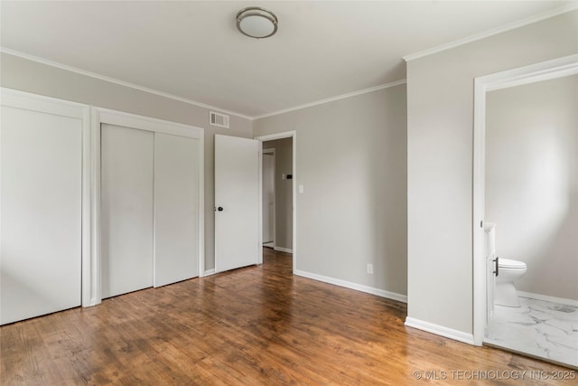 2904 S Hudson Pl, Tulsa, OK 74114 - unfurnished bedroom featuring ornamental molding, wood finished floors, and connected bathroom