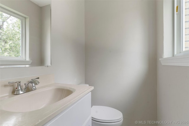2904 S Hudson Pl, Tulsa, OK 74114 - half bathroom featuring vanity and toilet