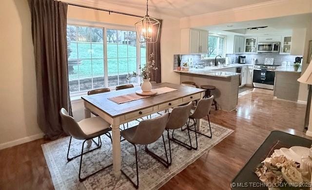 31990 S 624th Pl Unit 65, Grove, OK 74344 - dining space with a chandelier, light wood-type flooring, and ornamental molding