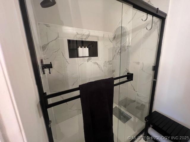 31990 S 624th Pl Unit 65, Grove, OK 74344 - bathroom with a marble finish shower