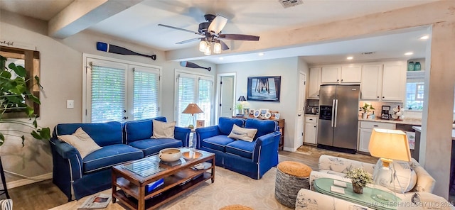 108256 Pike St, Checotah, OK 74426 - living area featuring beamed ceiling, healthy amount of natural light, recessed lighting, ceiling fan, and light wood-style flooring