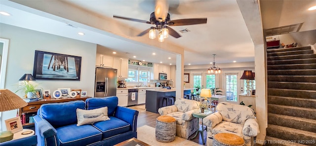108256 Pike St, Checotah, OK 74426 - living area featuring stairway, ceiling fan, recessed lighting, and light wood-style flooring