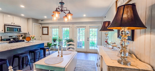 108256 Pike St, Checotah, OK 74426 - living area with french doors, wood finished floors, and recessed lighting