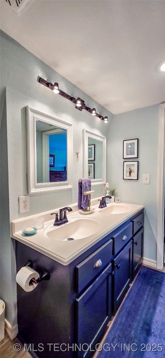 108256 Pike St, Checotah, OK 74426 - bathroom with double vanity and a textured wall
