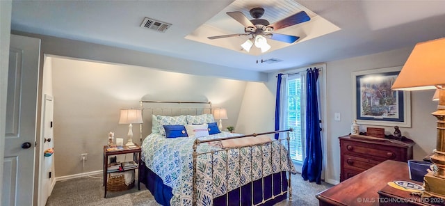108256 Pike St, Checotah, OK 74426 - carpeted bedroom with a raised ceiling and ceiling fan