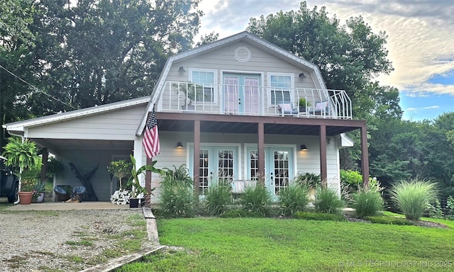 108256 Pike St, Checotah, OK 74426 - dutch colonial with french doors, dirt driveway, a gambrel roof, and a front lawn