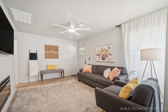 2837 E Admiral Ct, Tulsa, OK 74110 - living area featuring wood finished floors and ceiling fan