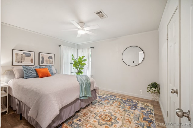 2837 E Admiral Ct, Tulsa, OK 74110 - bedroom with crown molding, wood finished floors, and ceiling fan