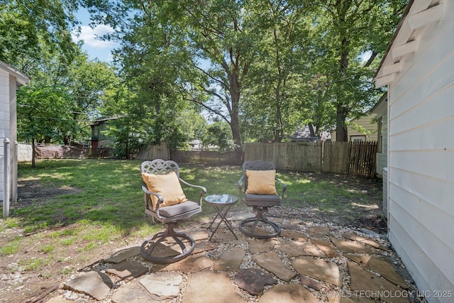 2837 E Admiral Ct, Tulsa, OK 74110 - fenced backyard with a patio