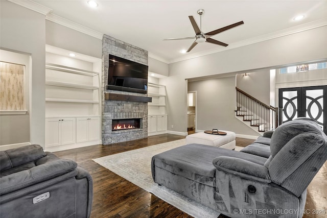 4603 E 118th Pl, Tulsa, OK 74137 - living room with a ceiling fan, crown molding, stairway, a fireplace, and built in features