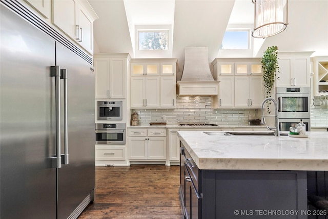 4603 E 118th Pl, Tulsa, OK 74137 - kitchen featuring stainless steel appliances, custom exhaust hood, and white cabinets