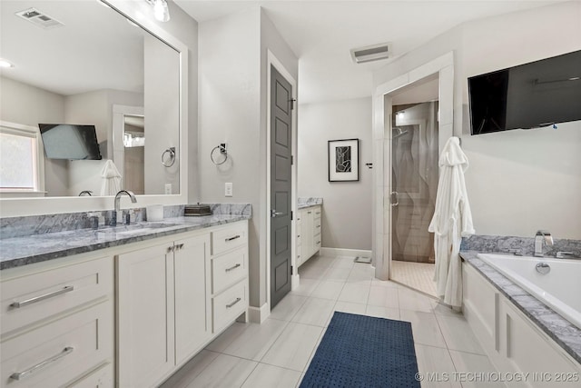 4603 E 118th Pl, Tulsa, OK 74137 - bathroom featuring a shower stall, vanity, a bath, and tile patterned floors
