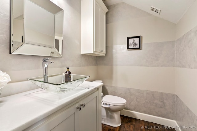 4603 E 118th Pl, Tulsa, OK 74137 - half bath featuring wood finished floors, vanity, and lofted ceiling