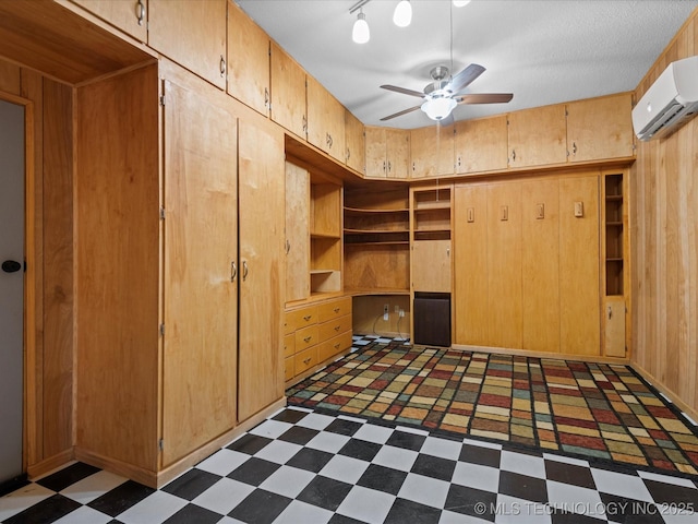 927 Macklyn Ln, Bartlesville, OK 74006 - unfurnished bedroom featuring tile patterned floors, a wall mounted air conditioner, and wooden walls
