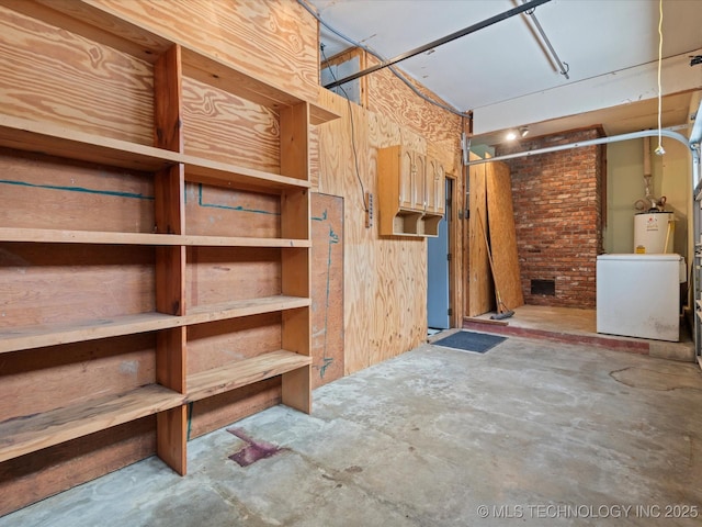 927 Macklyn Ln, Bartlesville, OK 74006 - storage room featuring water heater and washer / clothes dryer