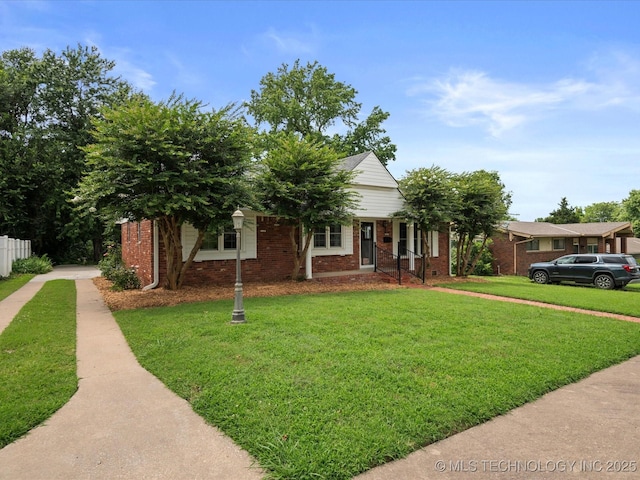 927 Macklyn Ln, Bartlesville, OK 74006 - view of front facade with brick siding