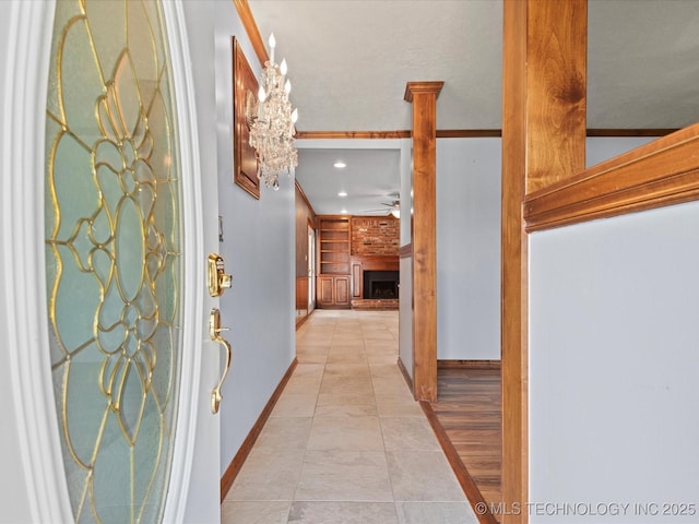 927 Macklyn Ln, Bartlesville, OK 74006 - hallway featuring light tile patterned flooring, recessed lighting, and a chandelier