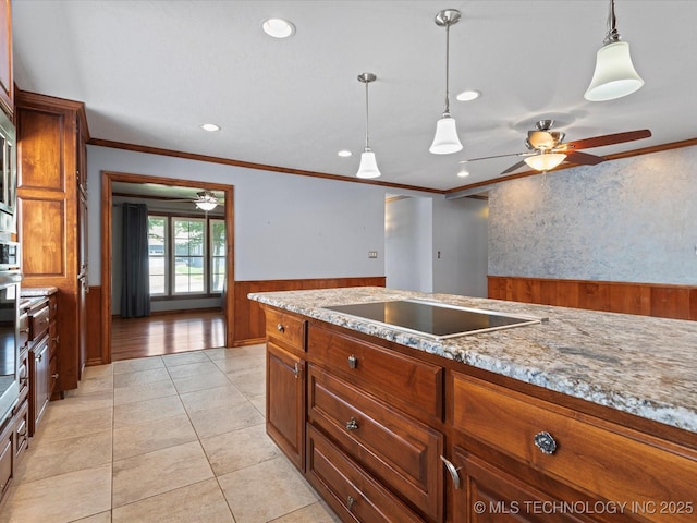 927 Macklyn Ln, Bartlesville, OK 74006 - kitchen with black electric stovetop, ceiling fan, ornamental molding, pendant lighting, and recessed lighting