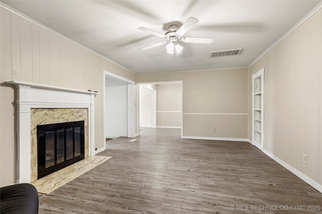 2900 S Cedar Ct, Broken Arrow, OK 74012 - unfurnished living room featuring wood finished floors, a ceiling fan, crown molding, and a fireplace