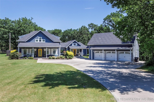 1528 Smysor Dr, Bartlesville, OK 74006 - view of front facade with a front lawn, a porch, driveway, and a shingled roof
