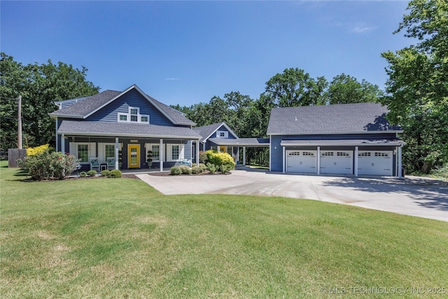 1528 Smysor Dr, Bartlesville, OK 74006 - view of front of home with concrete driveway, a front lawn, covered porch, and a shingled roof