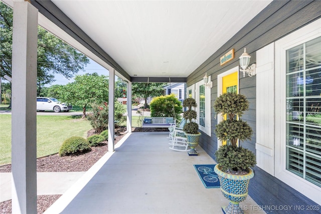 1528 Smysor Dr, Bartlesville, OK 74006 - porch featuring a yard