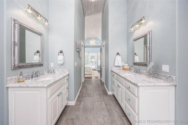 1528 Smysor Dr, Bartlesville, OK 74006 - bathroom featuring two vanities and ensuite bath