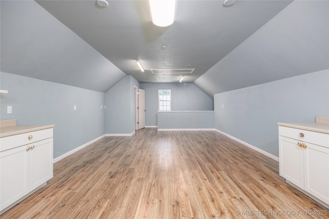 1528 Smysor Dr, Bartlesville, OK 74006 - bonus room featuring light wood-style flooring and lofted ceiling