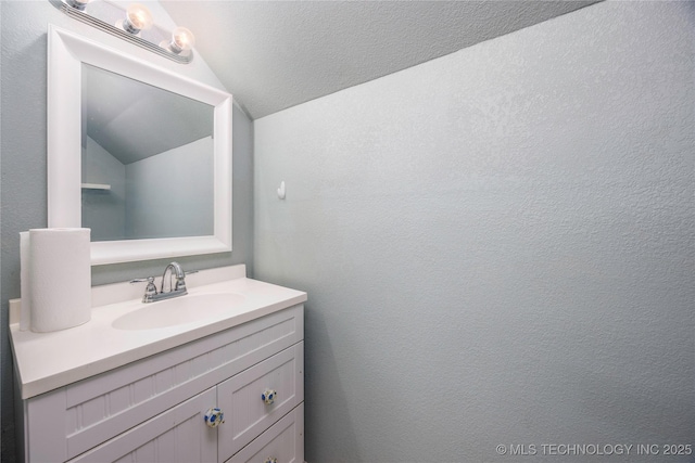 1528 Smysor Dr, Bartlesville, OK 74006 - bathroom featuring lofted ceiling and vanity