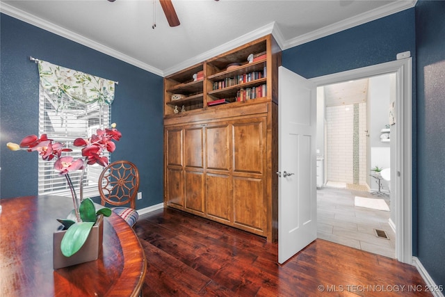 1528 Smysor Dr, Bartlesville, OK 74006 - home office featuring dark wood-type flooring, ornamental molding, and a ceiling fan