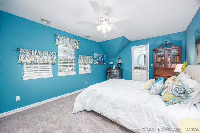 1528 Smysor Dr, Bartlesville, OK 74006 - carpeted bedroom featuring ensuite bathroom, a ceiling fan, and vaulted ceiling