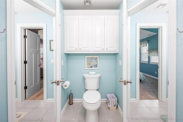 1528 Smysor Dr, Bartlesville, OK 74006 - bathroom featuring connected bathroom, french doors, and tile patterned flooring