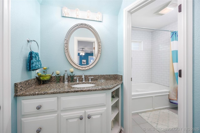 1528 Smysor Dr, Bartlesville, OK 74006 - bathroom featuring vanity, shower / tub combo, tile patterned flooring, and a ceiling fan