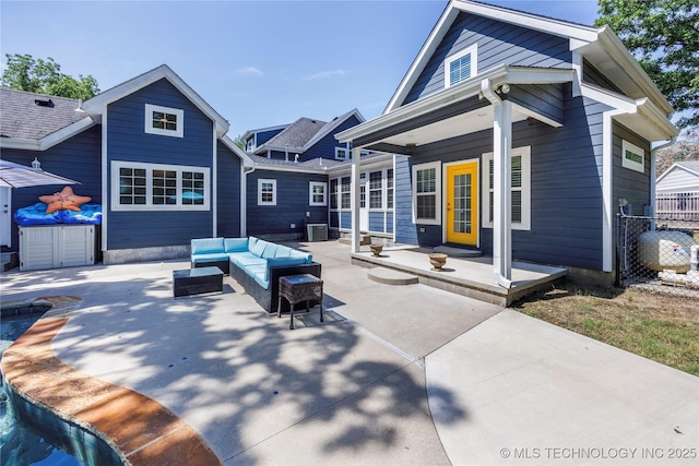 1528 Smysor Dr, Bartlesville, OK 74006 - back of property featuring an outdoor living space and a patio area