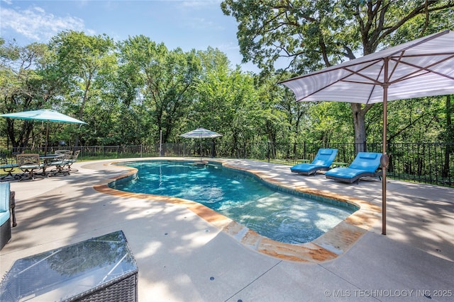 1528 Smysor Dr, Bartlesville, OK 74006 - view of swimming pool with a patio and view of wooded area