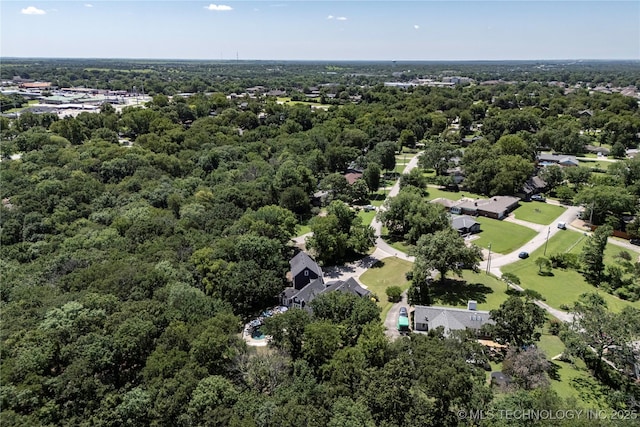 1528 Smysor Dr, Bartlesville, OK 74006 - view of property location with a heavily wooded area