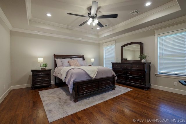7141 E 138th Pl, Collinsville, OK 74021 - bedroom featuring a tray ceiling, dark wood-type flooring, ornamental molding, a ceiling fan, and recessed lighting