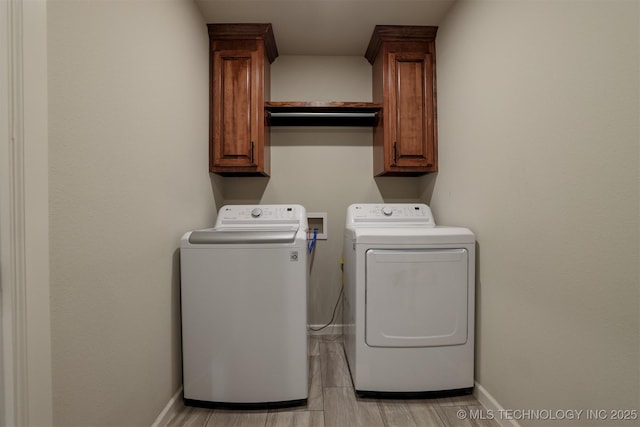 7141 E 138th Pl, Collinsville, OK 74021 - laundry area with washer and dryer, cabinet space, and light wood-style flooring