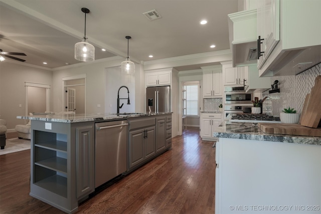 7141 E 138th Pl, Collinsville, OK 74021 - kitchen with appliances with stainless steel finishes, gray cabinetry, crown molding, white cabinetry, and open shelves