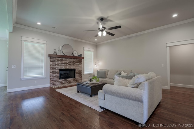 7141 E 138th Pl, Collinsville, OK 74021 - living area featuring ceiling fan, dark wood-style flooring, a fireplace, recessed lighting, and ornamental molding