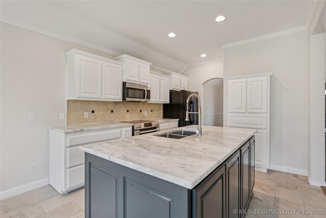 2629 S 13th St, Broken Arrow, OK 74012 - kitchen with stainless steel appliances, ornamental molding, arched walkways, white cabinetry, and backsplash