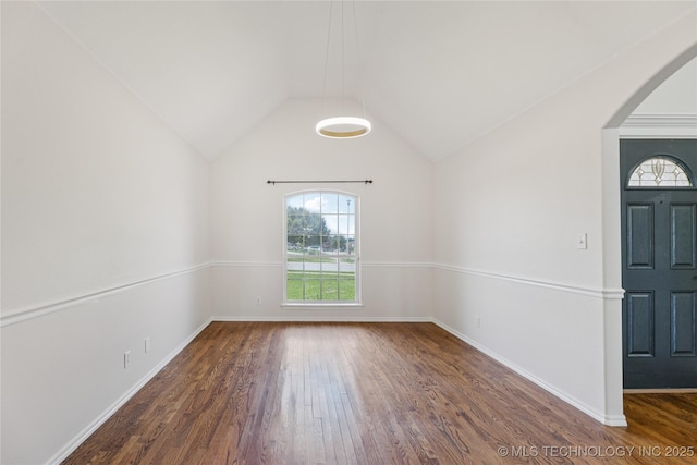 2629 S 13th St, Broken Arrow, OK 74012 - unfurnished room featuring plenty of natural light, wood finished floors, lofted ceiling, and arched walkways