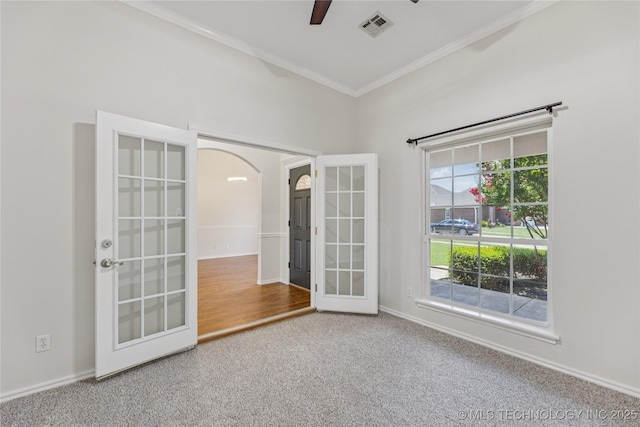 2629 S 13th St, Broken Arrow, OK 74012 - spare room with french doors, ornamental molding, a ceiling fan, carpet flooring, and arched walkways