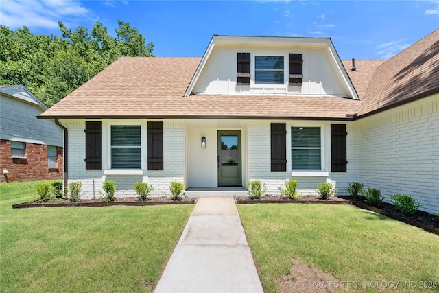 1400 W Jackson St, Broken Arrow, OK 74012 - view of front facade featuring brick siding, a front yard, and roof with shingles